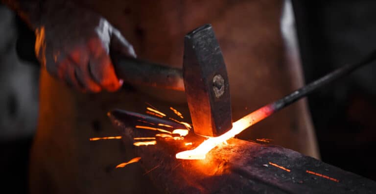 Resources 4 Blacksmith forging iron, symbolic of the way sales consulting can refine a company
