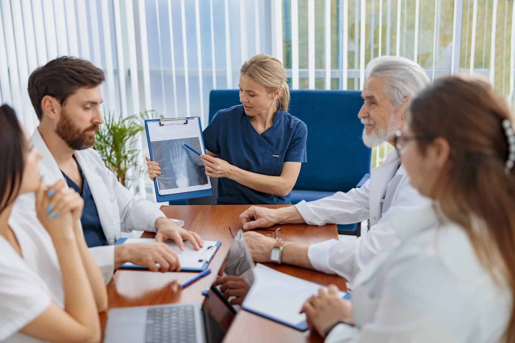 Successful medical doctors are discussing diagnosis during the conference