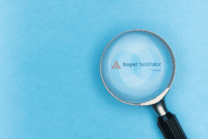 magnifying glass on light blue background showing buyer facilitator sales training logo