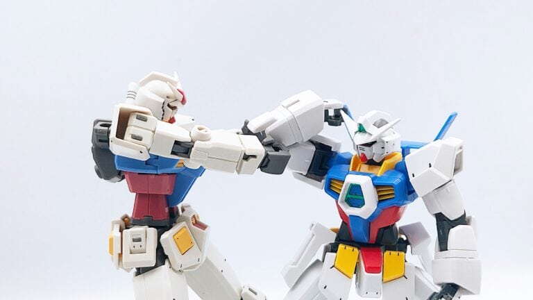 two colorful red, blue yellow, white robots punching each other