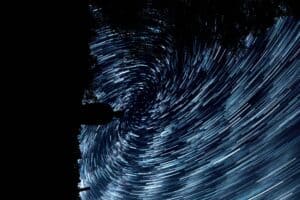 millions of swirling blue lights in the night sky