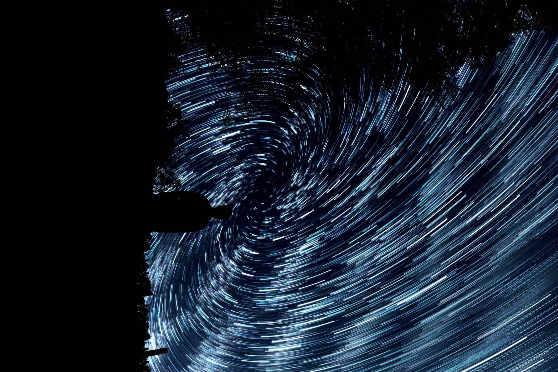 millions of swirling blue lights in the night sky