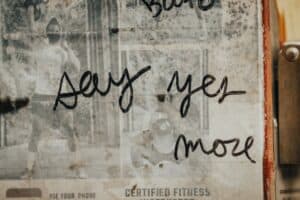 gym wall with cursive quote say yes more