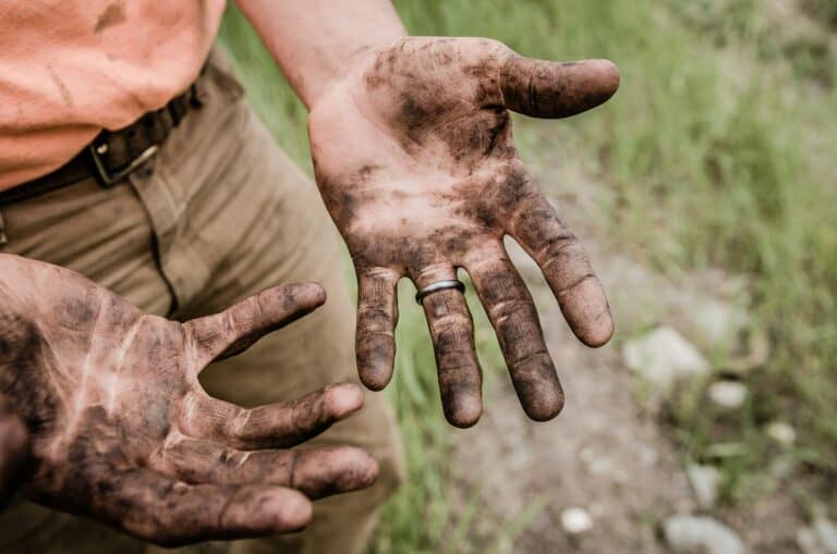 hands with dirt after hard day of prospecting