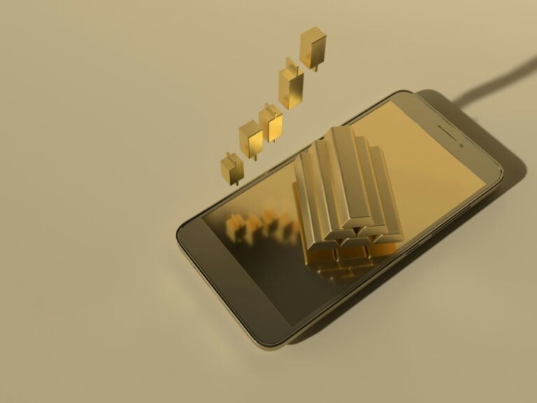 Resources 4 gold iphone with gold bars coming up from it asking why is prospecting so challenging