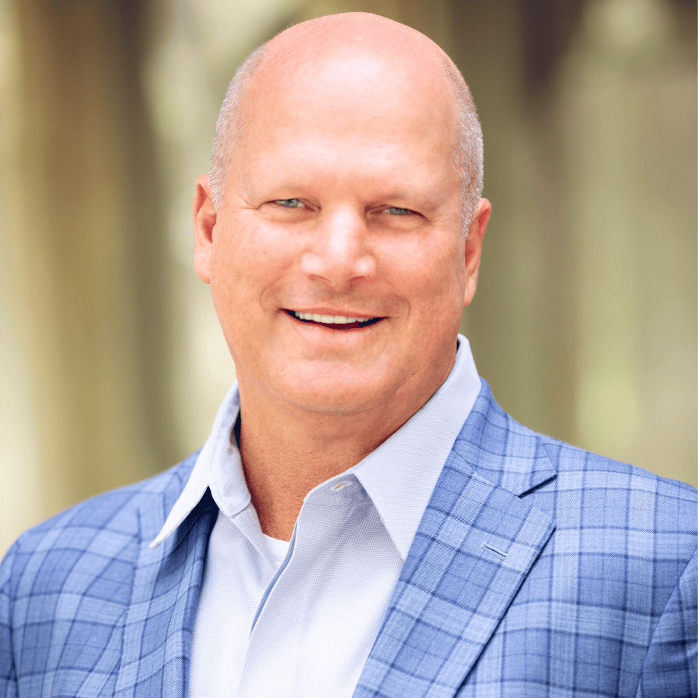 professional sales consultant in blue checked blazer