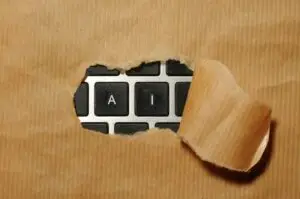 Peeling back the kraft paper to reveal the letter A I